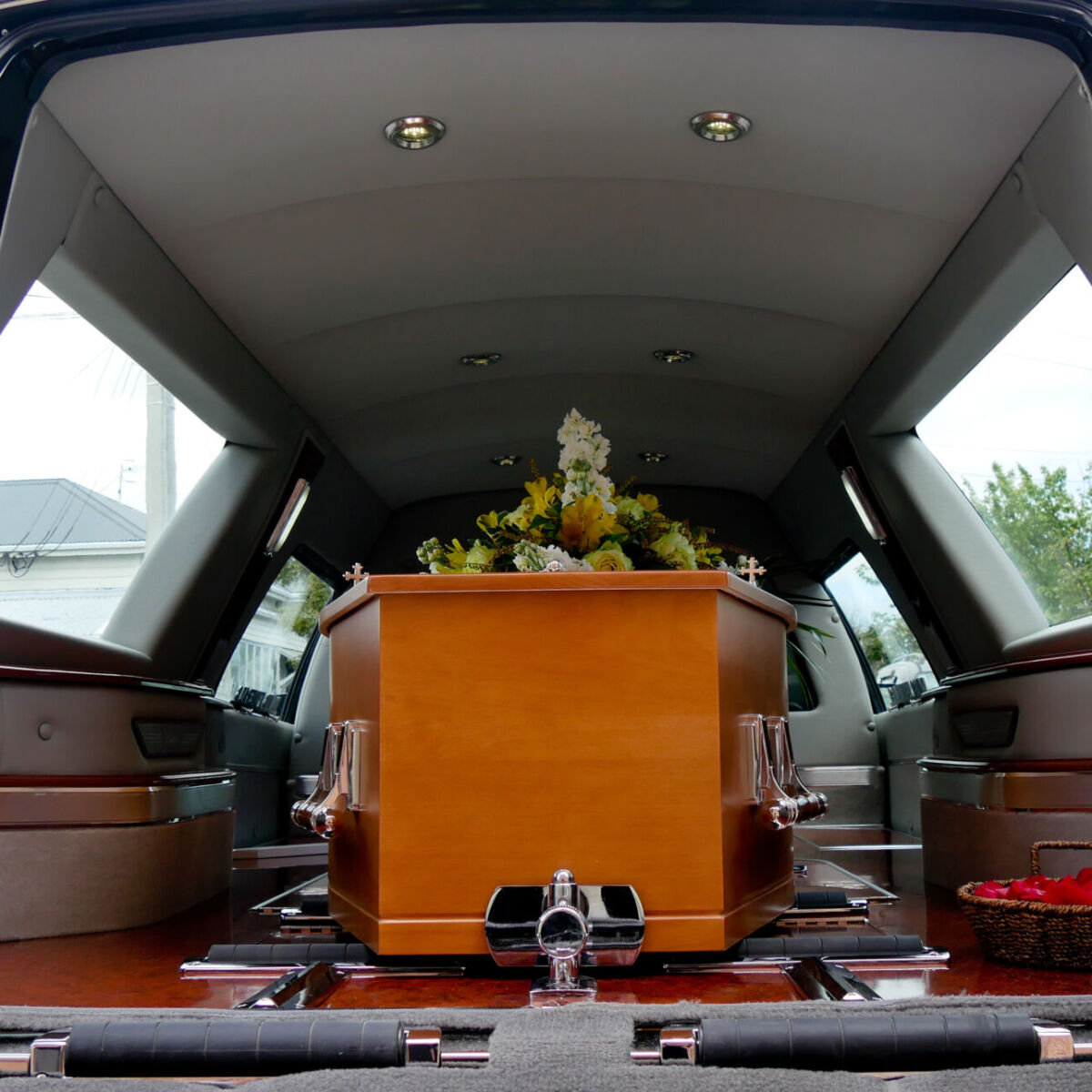 closeup shot of a colorful casket in a hearse or chapel before funeral or burial at cemetery